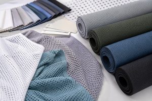 Lightweight polyester fabric rolls and open mesh swatches for wholesale sourcing