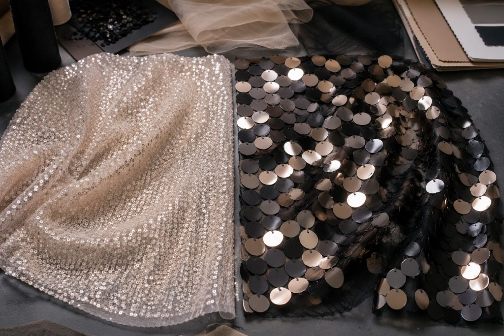 Micro sequins compared with large paillettes on mesh for 2027 sourcing