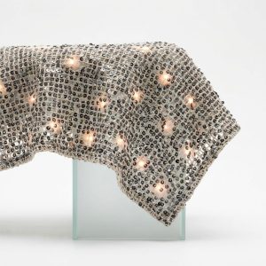 Solar-Charged Sequin Fabric – Day-to-Night Glow for Sustainable Swimwear & Resort Collections