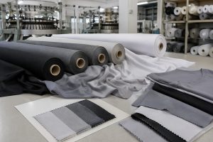 Smooth polyester interlock fabric rolls for apparel production sourcing