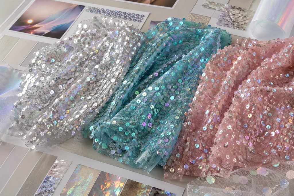 Holographic sequin mesh fabric trend swatches for 2027 fashion sourcing