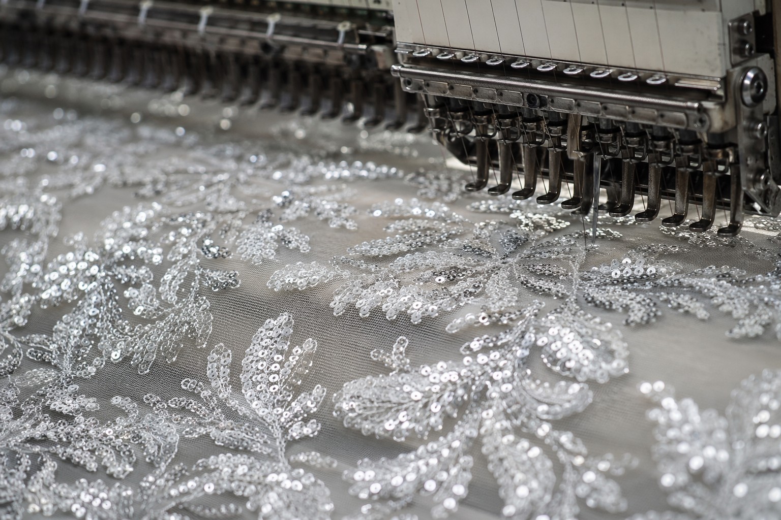 Industrial-grade sequin embroidery fabric under precision machine quality control