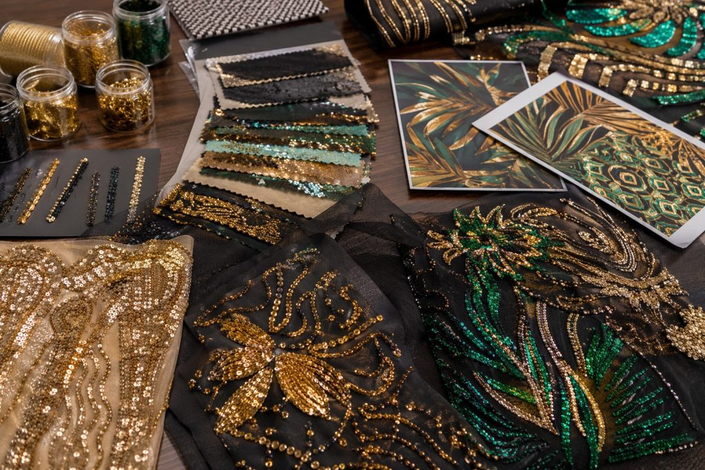 Gold, emerald and black sequin embroidery fabrics for African fashion sourcing