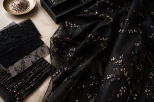 Black embroidery mesh with sequin detail for premium Gulf abaya fabric sourcing
