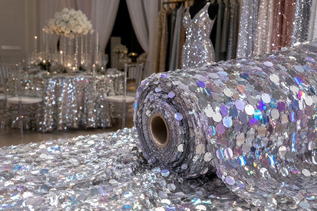Large iridescent sequin fabric on tulle for event decor and statement fashion