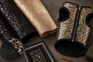 Durable black and champagne sequin fabric swatches for luxury pet wear sourcing