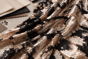 Matte champagne and black sequin fabric on mesh for premium wholesale sourcing