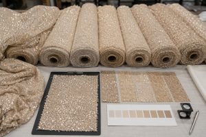 Approved sequin fabric swatch matched with bulk rolls for color consistency