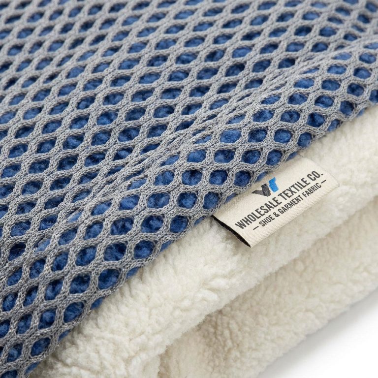 Blue and gray knitted spacer mesh layered over cream fleece, shoe and garment composite fabric