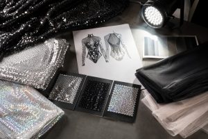 Silver black and iridescent sequin mesh swatches for performance costume sourcing