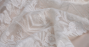Innovative bridal lace embroidery blending modern geometric motifs with classic florals
