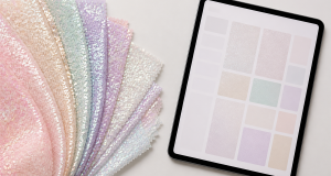 Pastel iridescent sequin fabric swatches fanned beside a tablet showing a digital swatch grid for fast-fashion digital sampling
