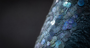 Shimmering sequins on a base of clearly textured recycled ocean plastic fabric