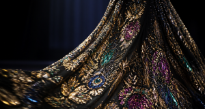 Dynamic fashion runway detail showing top-tier sequin and embroidery embellishments in motion