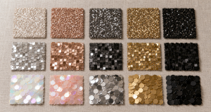 Flat-lay grid of fifteen sequin fabric swatch cards covering round, square and paillette sequin types across iridescent, rose gold, silver, gold and black colorways on neutral linen